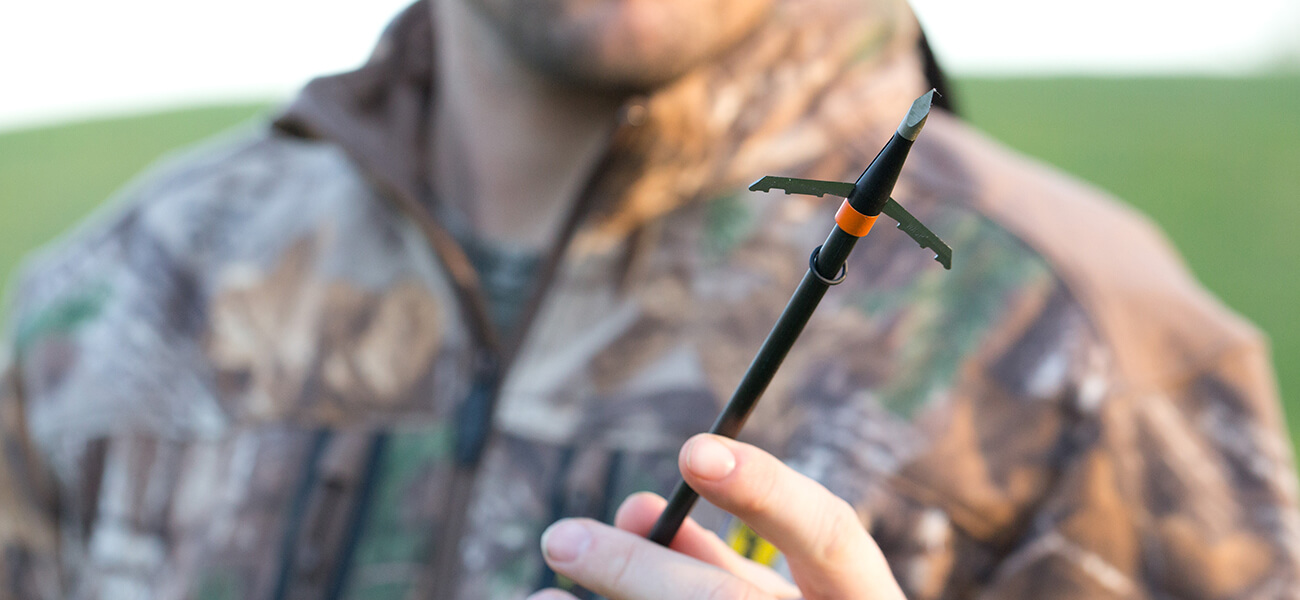 Man holding arrow with Wasp Broadhead | How to know if you have the best broadhead