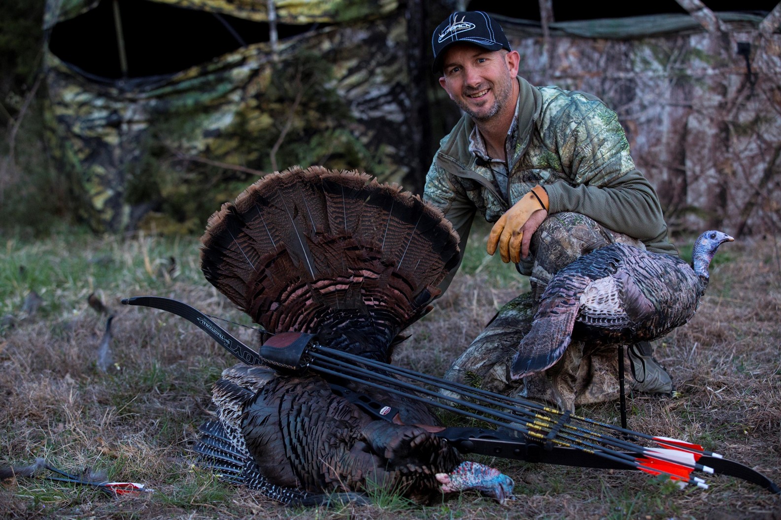 Hunter with Turkey and Broadheads